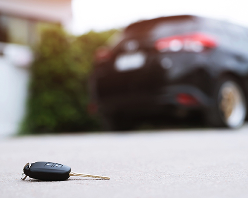 image of lost car key on concrete