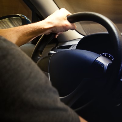 Hand on steering wheel