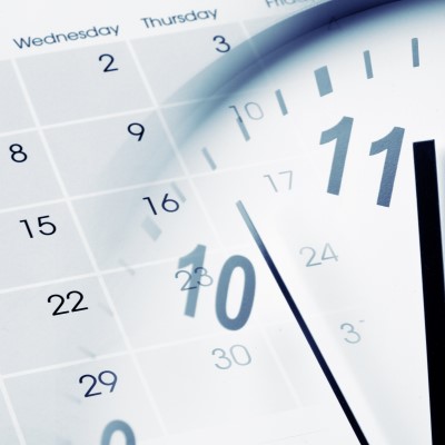 Close-up of clock and calendar