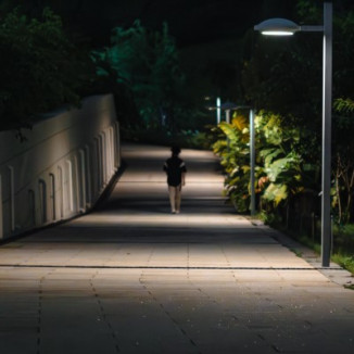 College student walking alone at night.
