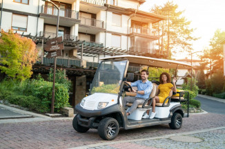 Residents of property riding in a golf cart